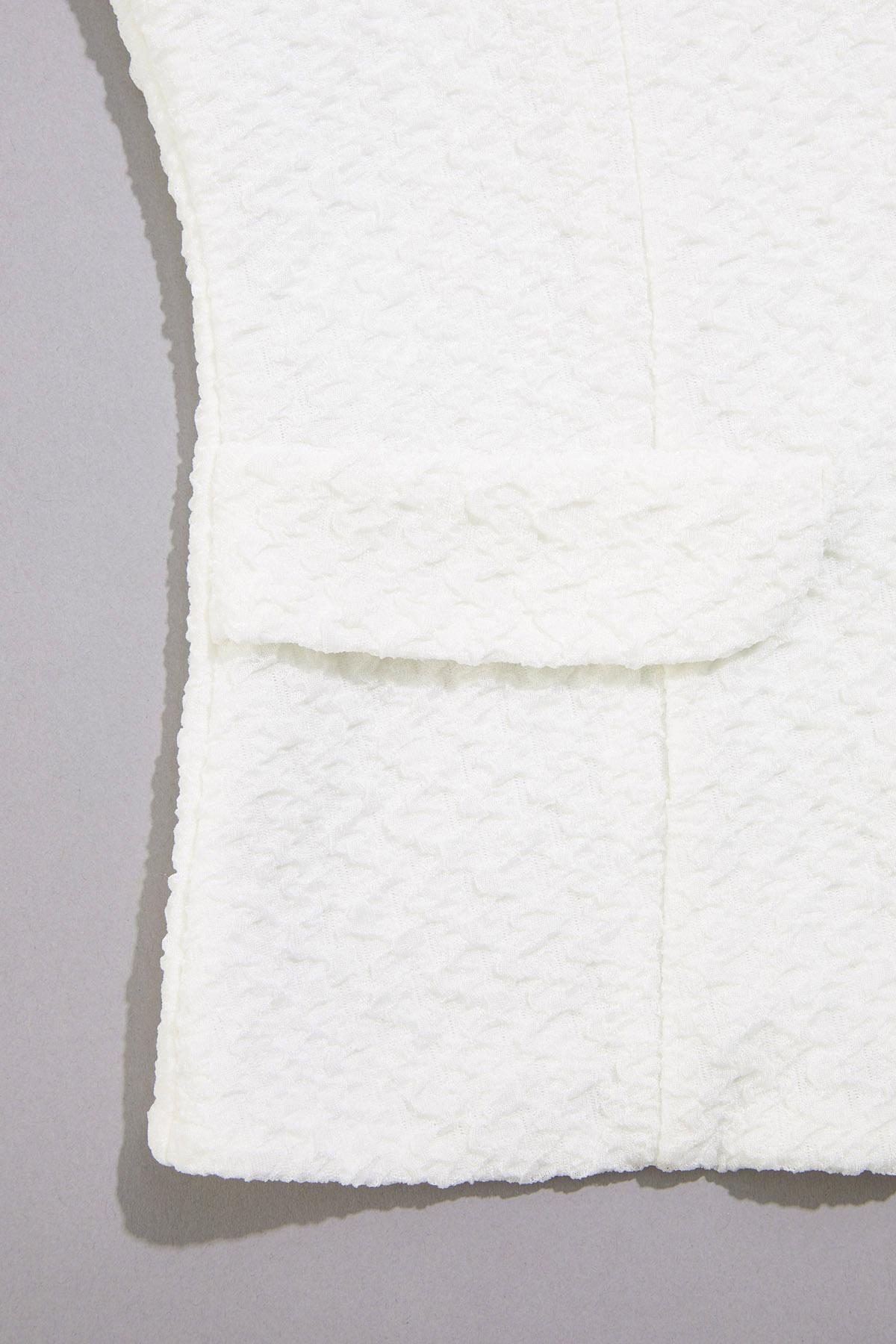cache textured button detail top Versona Caché