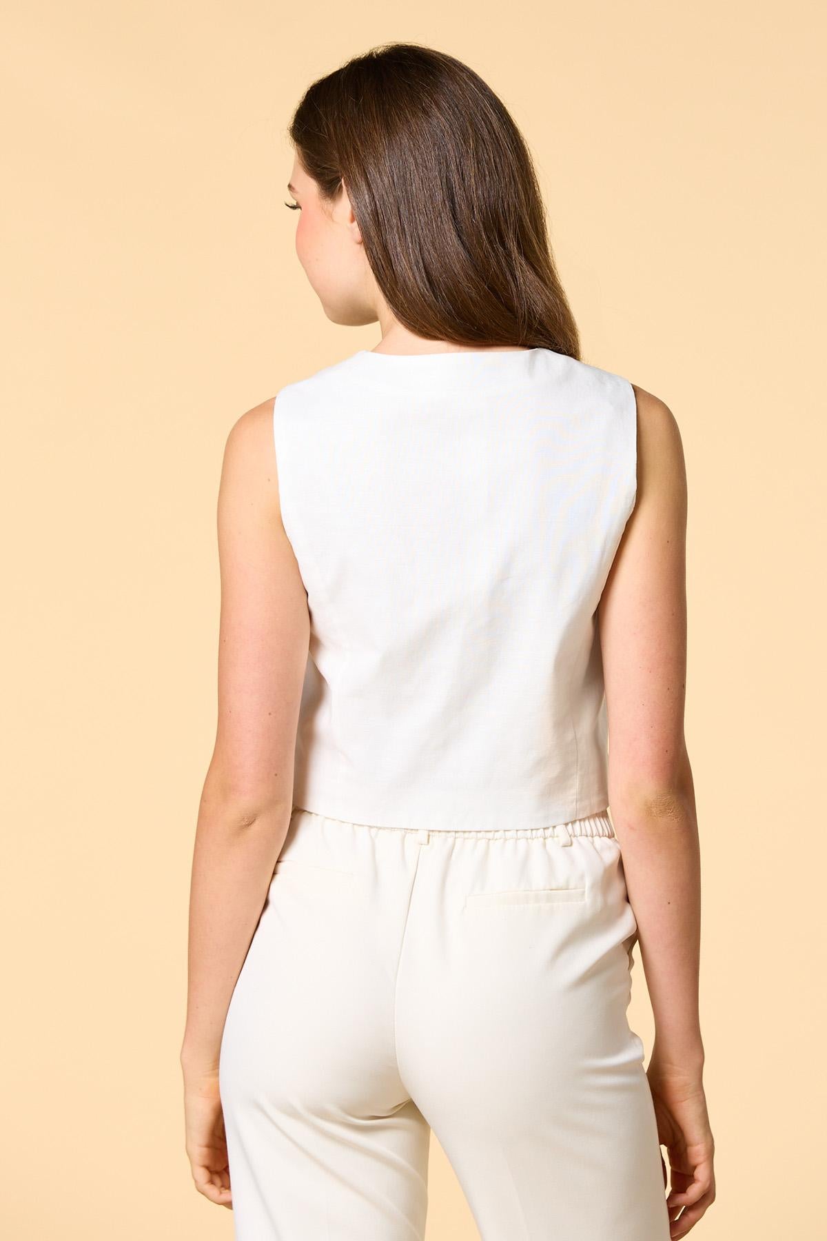 in stitches embroidered vest Versona Apparel
